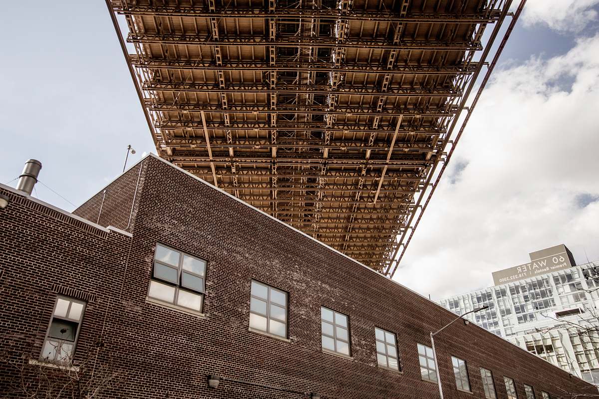 brooklyn bridge low angle photo of brown concrete building brick